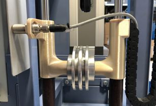 RUSTIN deploys its Fortus 450mc to create internal production-line tooling. The photo shows a weight optimization tool produced in ULTEM™ 9085 resin.