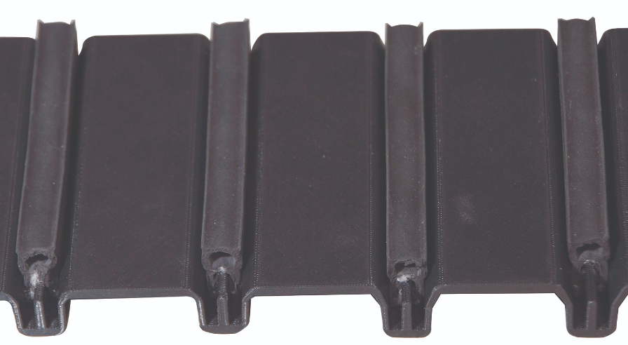 This FDM part (top and side view) allows
testing of four variations of a groove that
mates with a rubber seal.&nbsp;