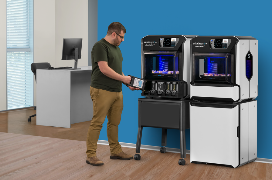 A man mounting material tray in the J3 DentaJet