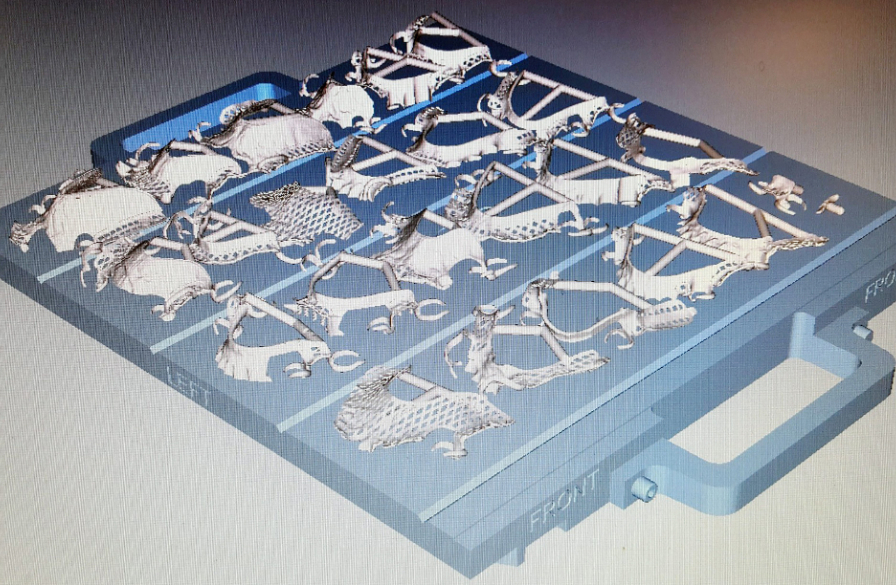 This screen capture of Objet Studio software shows 25 parts loaded on the build tray in preparation for printing.