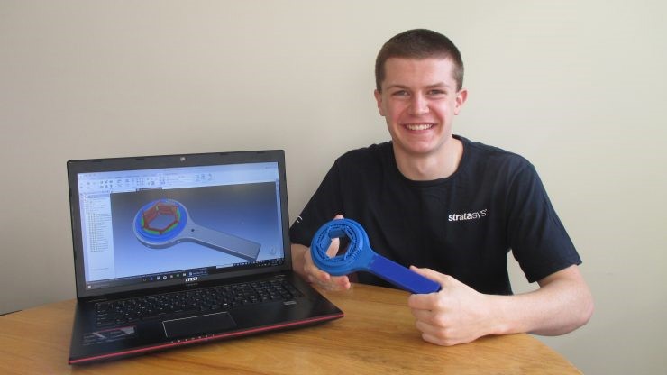 <p>Student showcasing their 3D printed design and prototype.&nbsp;</p>