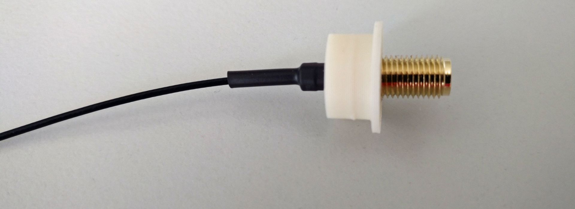Isolator for SMA socket