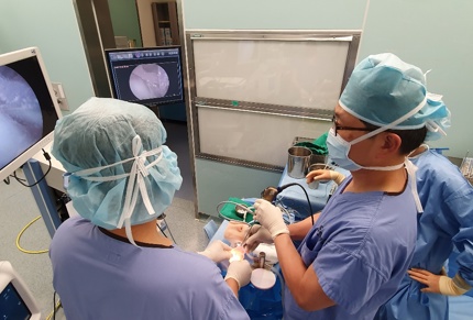 Doctors working with 3D printed parts.