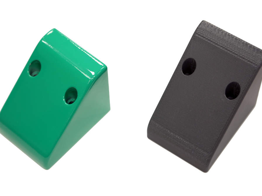 Strong, yet lightweight 3D printed protective casing used on robotic packaging machines. Produced with the Stratasys Fortus 450mc in FDM Nylon 12CF material and finished with green varnish.