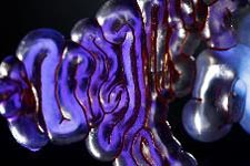 Back piece of Mushtari filled with chemiluminsecent liquid. The fluid channels in the wearable, 3D printed by Stratasys, stretch to around 58 meters and inner channel diameters range from 1 mm to 2.5 cm. Photo credit: Jonathan Williams and Paula Aguilera, courtesy of Mediated Matter. 