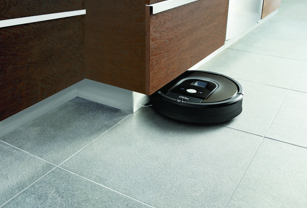 Roomba vacuum cleaner under counter top in kitchen