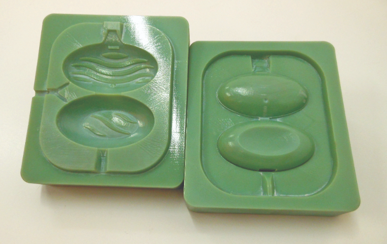 A 3D printed injection mold for a Domestos-brand toilet
rim block