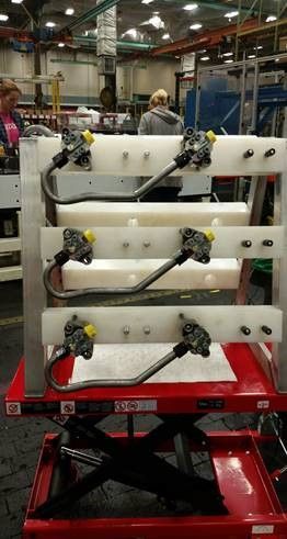 Caterpillar assembly rack cart.