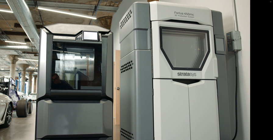Fortus 450mc and 370 3D Printers next to each other