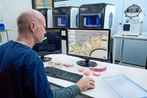 Dental lab tech working on GrabCAD