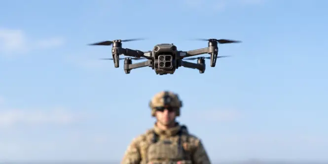 3D Printed Military Drone floating in front of soldier