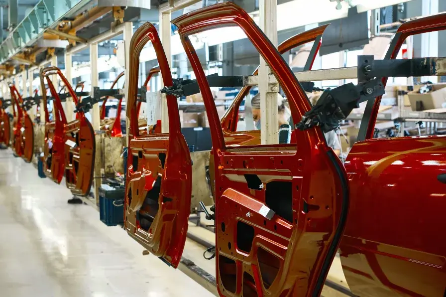 automotive assembly line red car doors