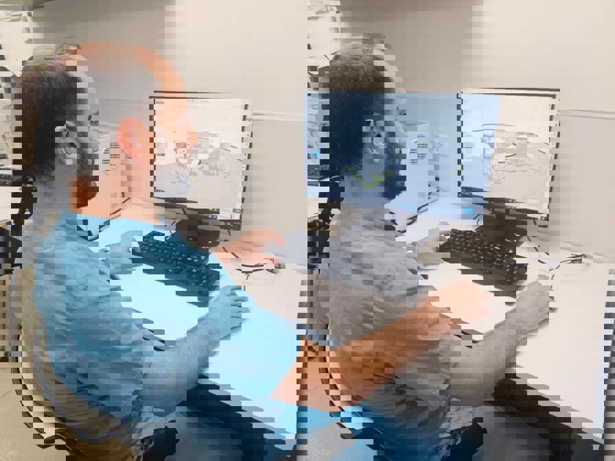 Suregon reviewing craniomaxillofacial 3D printed CAD